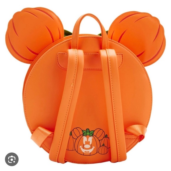 Disney Minnie Pumpkin Loungefly glows in the dark on her face. - Picture 2 of 3